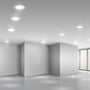 Illustration af et rum med V-TAC LED paneler indbygget i loftet, der lyser med 4000K neutral hvidt lys.