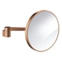 GROHE Selection kosmetikspejl i børstet kobber med 224mm diameter og 7x forstørrelse, monteret på en svingarm på hvid baggrund.