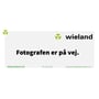 Wieland logo og tekst 'Fotografen er på vej.' med kontaktoplysninger.