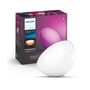 Philips Hue Go bærbar lampe i hvid, vist sammen med sin farverige æske, der fremhæver 'White and Color Ambiance' funktionerne.