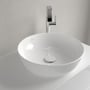 Villeroy & Boch Artis 4179 håndvask set skråt oppefra med afløbsdæksel og vandhane synlige.