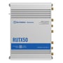 Bagsidevisning af Teltonika RUTX50 5G router med seks SMA-stik til antenner og mærkning for strømindgang.