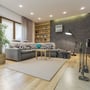 En stue oplyst af flere V-TAC Pro spotlights indbygget i loftet for et rent og moderne look.