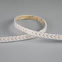 Ansell Lighting K-Cell LED strip, 12mm bred og 50 meter lang, med guldfarvede lodninger og hvide LED'er på en grå baggrund.