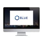 Schneider Electric Pro-face BLUE Basic software på en computer-skærm med en bybaggrund i mørke. Logoet er tydeligt synligt i midten.