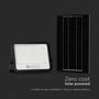 V-TAC 10 W solcelle-LED-projektør med separat solpanel set forfra mod mørk baggrund.