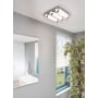 EGLO Tolorico loftlampe i krom med fire LED-lysrør, monteret i et moderne badeværelsesmiljø.