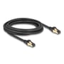 DeLock sort 3 meter Cat.6A S/FTP netværkskabel med afskærmede RJ45-stik på hvid baggrund.