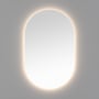 Loevschall Blokhus ovalt spejl belyst af integreret backlight, med en blød varm glød rundt om kanten.