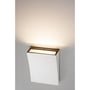 SLV Delma Wide LED-væglampe monteret på en væg og lyser varmt opad fra den åbne top.