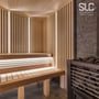 Sauna med moderne design og lodrette lysstriber fra SLC langs væggen og under bænkene.