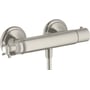 AXOR Montreux brusetermostat med krydsgreb og steel-optik finish, vist fra siden med fokus på greb og termostatdel.