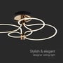 Nærbillede af V-TAC LED designerlampens moderne design med snoede ringe i sort og guld, der udsender et varmt lys.