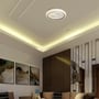 V-TAC LED-loftslampen lyser monteret i loftet over en sofa og giver et varmt skær i stuen.