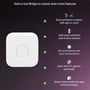 Illustration der viser Philips Hue Bridge og dens funktioner, såsom nem ambiance-styring, integration af smart switches og synkronisering med medieindhold.