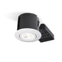 Philips Hue indbygningsspot, rund, mat hvid front, sort cylinder med drejelig funktion, vist fra en lav vinkel på hvid baggrund.