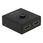 DeLock HDMI-switch set fra en anden vinkel med de to HDMI-porte på fronten og valgknap samt indikatorer på toppen.