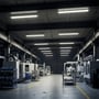 V-TAC LED-armaturer lyser i loftet over maskiner og arbejdsområder i et industrielt værksted.