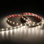 Ansell Lighting E-Cell Eco LED strip med varmt hvidt lys og 3M tape på bagsiden, rullet op.