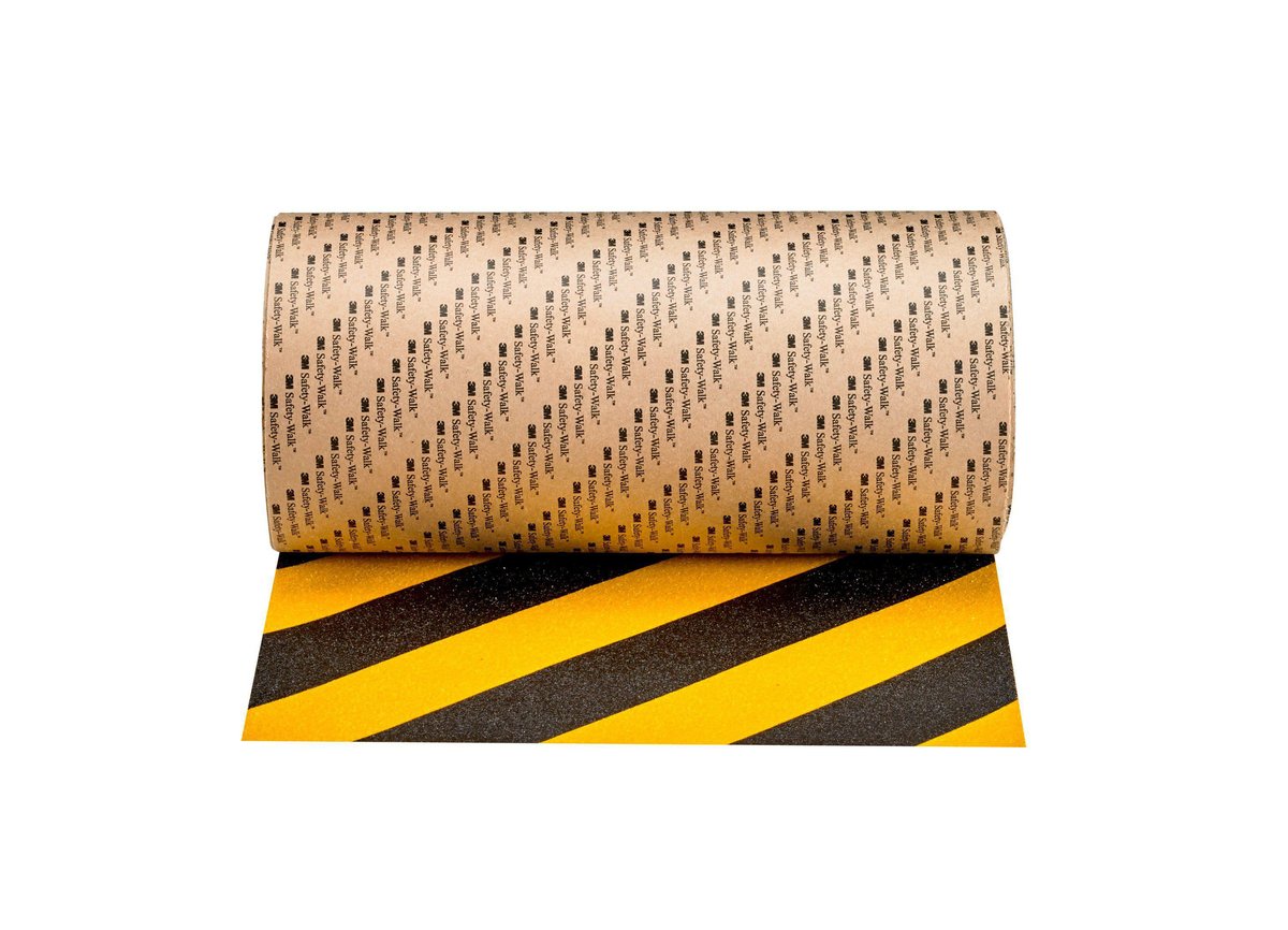 3M Safety-Walk 613 skridsikringstape med sorte og gule striber, rullet ud og viser den taktile overflade.